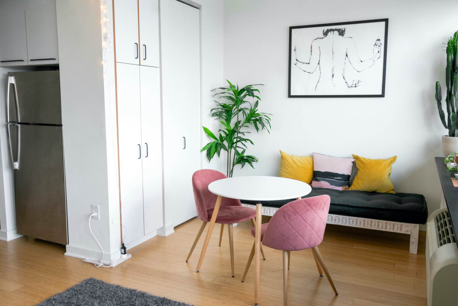 Studio apartment with small dining area and colorful furniture