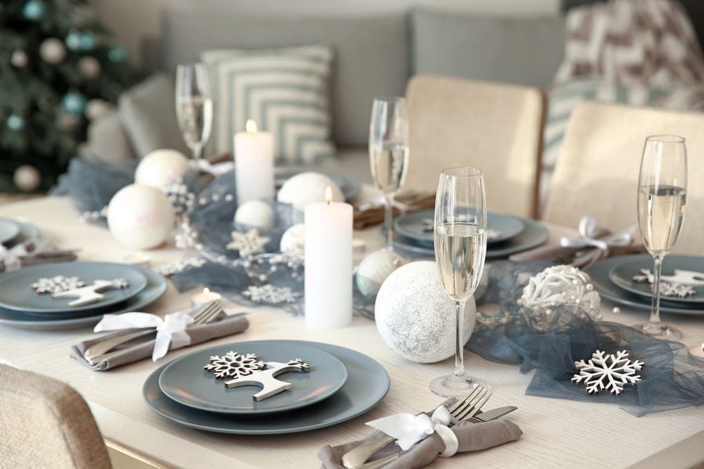 festive table set with candles as centrepieces 