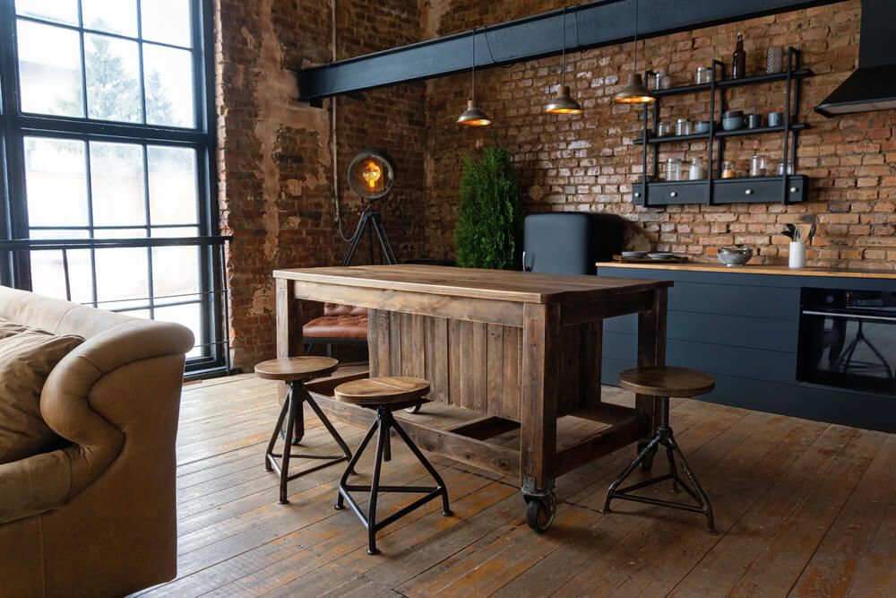 industrial style kitchen with exposed brick wall