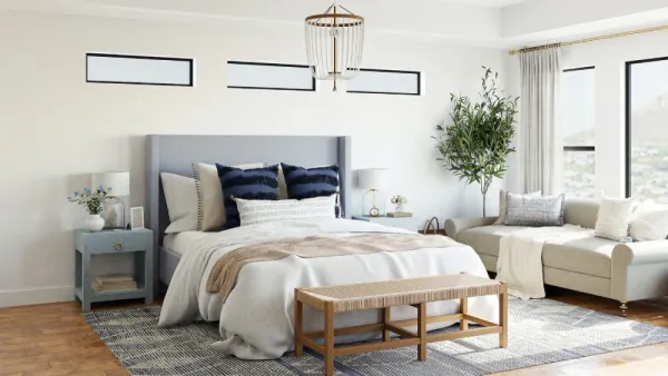 airy bedroom with seating area