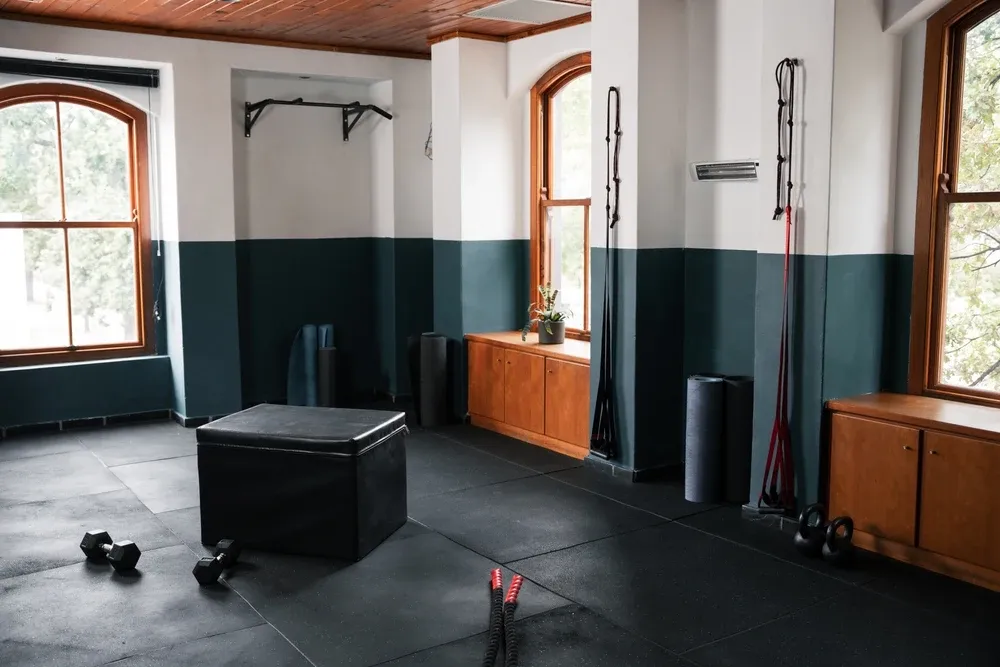 Empty gym with black mats