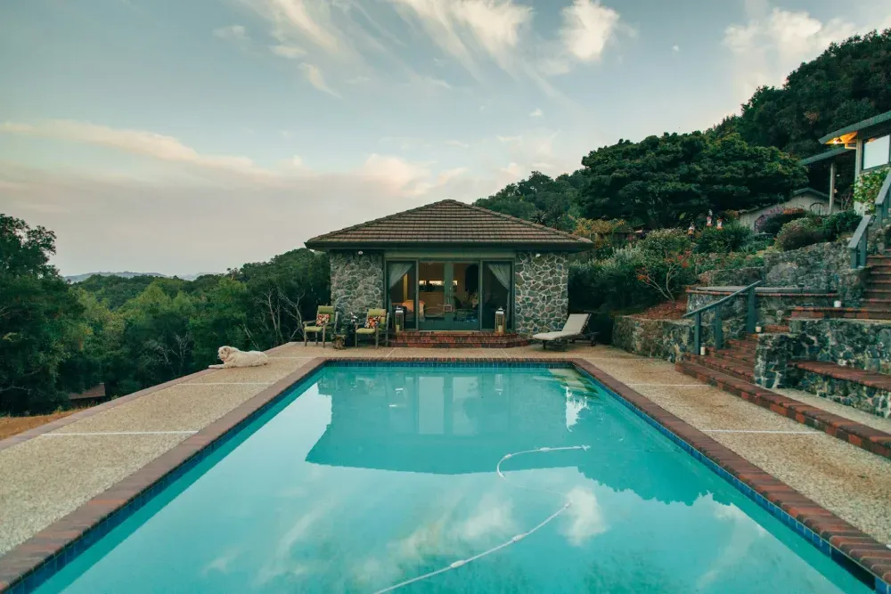 stone pool house by the pool